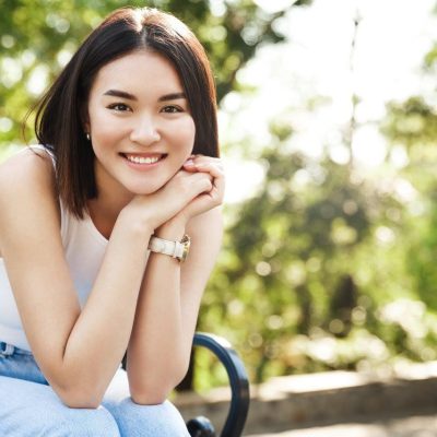 beautiful-asian-woman-sitting-bench-smiling1